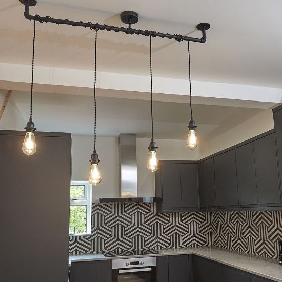 Picture of Metal Ceiling Light Fitting featuring Industrial Black Pipe Pendant Design