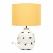 Picture of Bumble Bee Table Lamp with White Ceramic Base And Yellow Lampshade Creating  Warm Living Room Glow